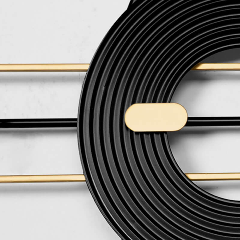 Close-up of the luxury geometric oversized minimalist wall clock on a modern wall.