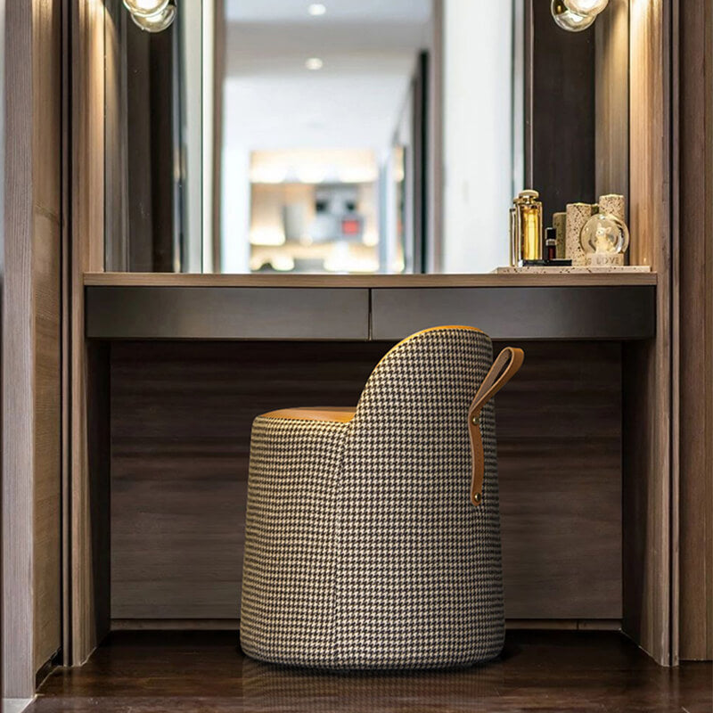 Front view of the chic houndstooth leather makeup stool showcasing its elegant design.