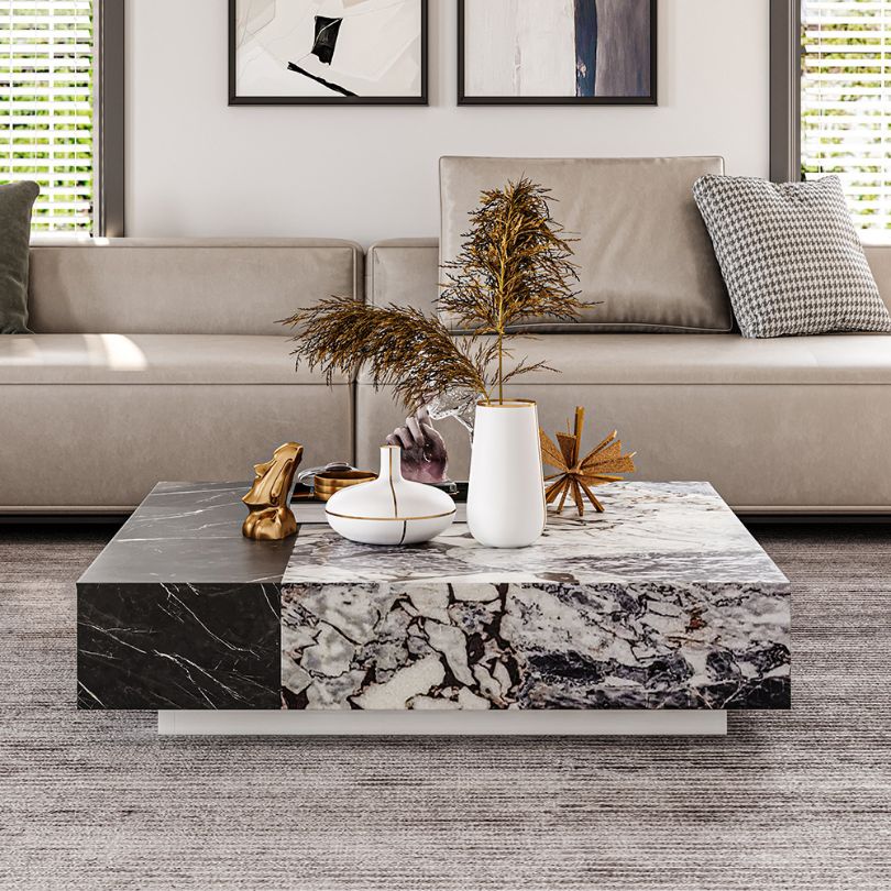Elegant modern marble coffee table with wooden drawer, viewed from the front showcasing its smooth finish and sleek design.