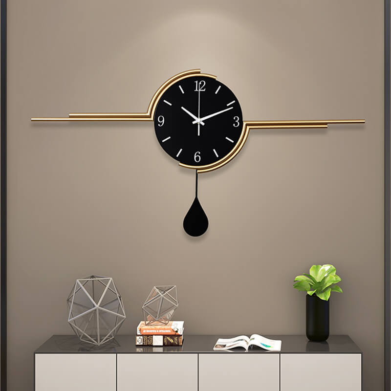 Close-up view of the black and gold geometric wall clock showcasing its modern design.
