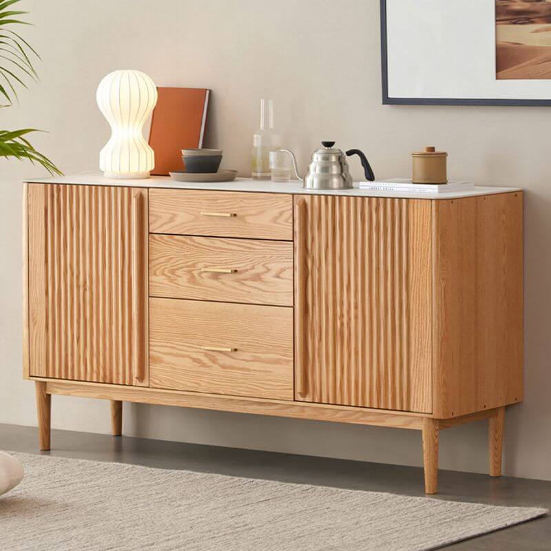 Front view of stylish sideboard with stone top showcasing drawer layout and natural oak texture