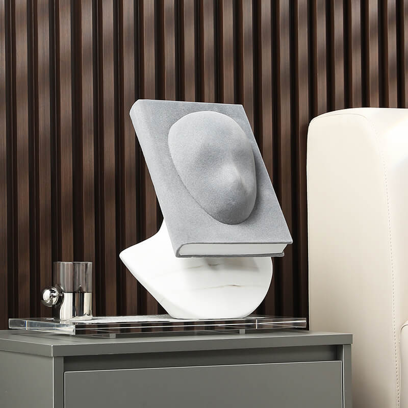 Nordic Creative Face Sculpture displayed on a modern bookshelf, highlighting its abstract design.