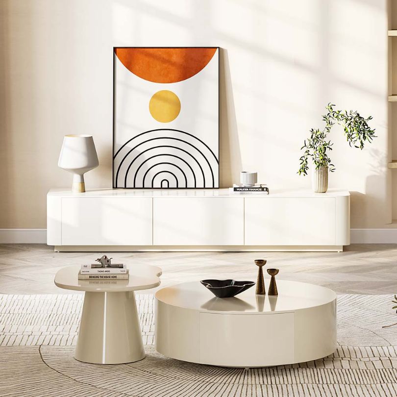 A side angle of the Nordic Serenity Rounded Coffee Table demonstrating the spacious drawers and sturdy pedestal base.