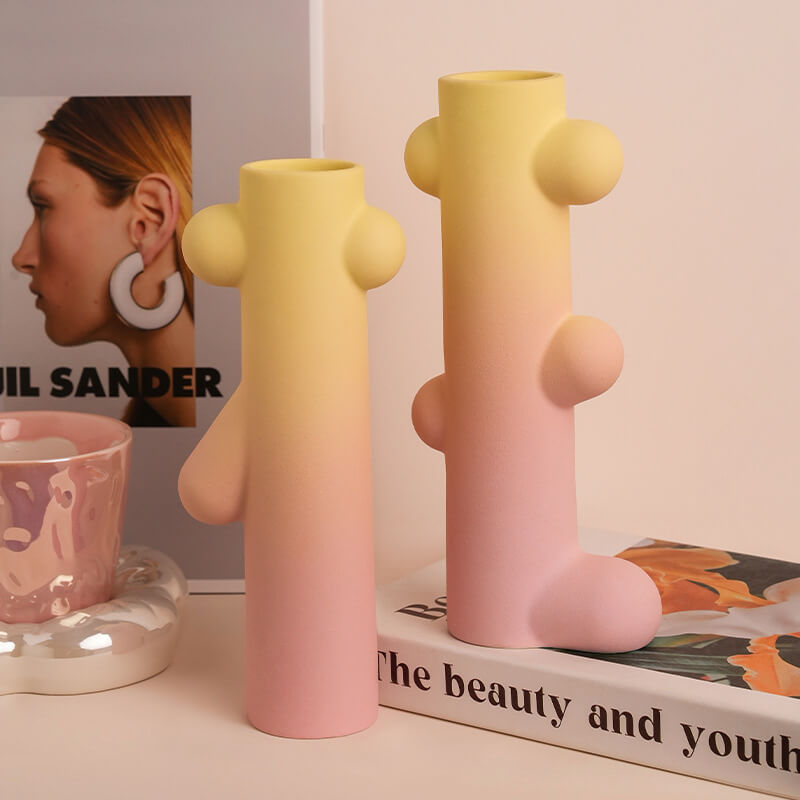 Nordic tall ceramic vase set showcasing dried flowers on a table.