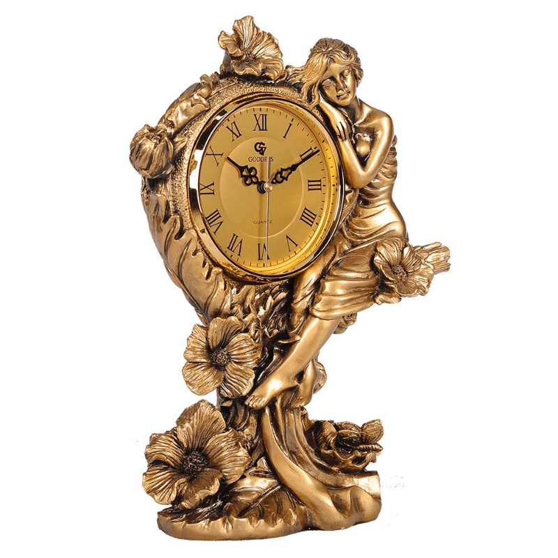 Front view of the vintage analog tabletop clock showcasing its floral designs and human sculpture.