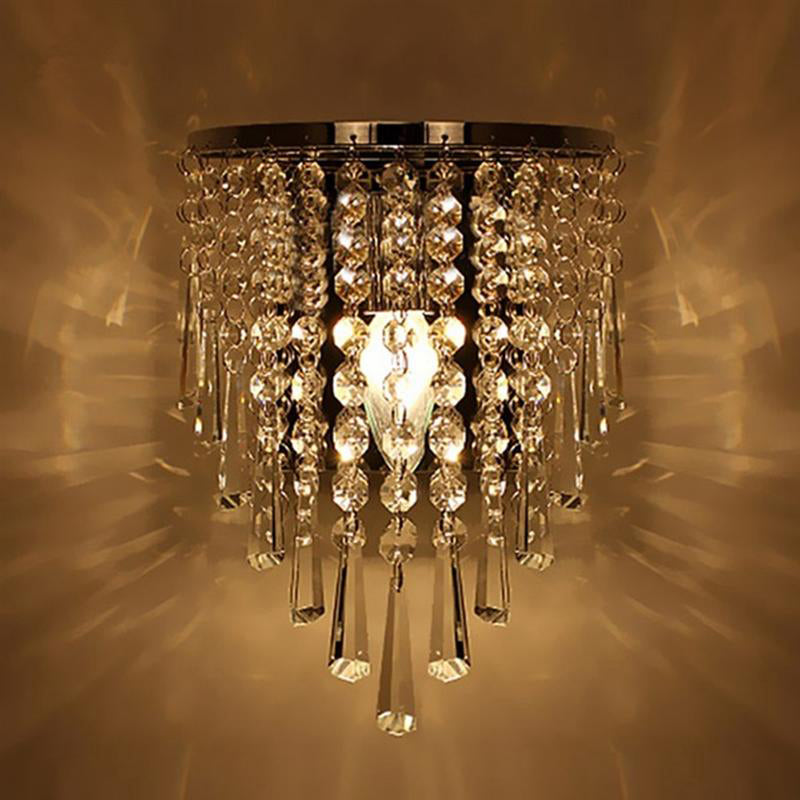 Elegant chrome crystal drop wall sconce showcasing its intricate design from a side angle.