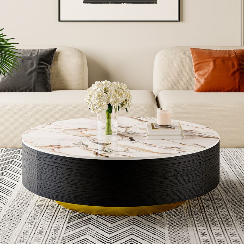 Chic retro drum coffee table with a glossy top and two drawers, showcasing modern design in a stylish living room setting.