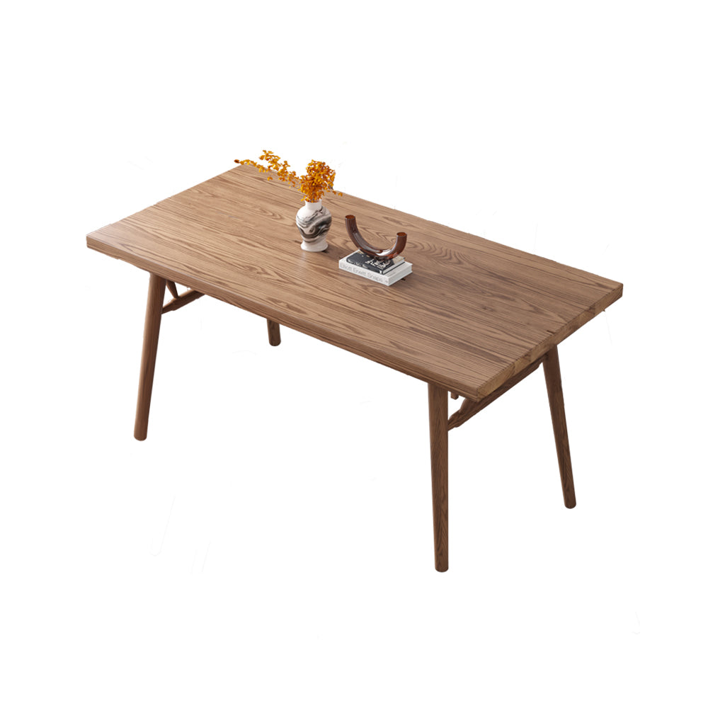 Top view of the modern dining table highlighting the natural wood grain and sleek legs.