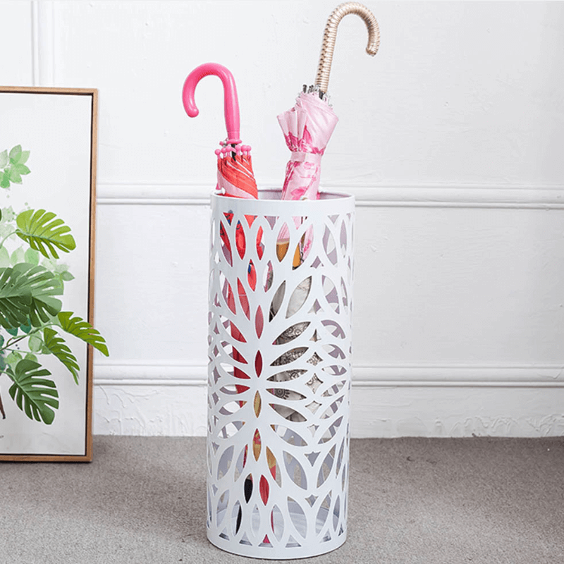Stylish Steel Leaves umbrella stand showcasing its hollowed-out design and drip tray.