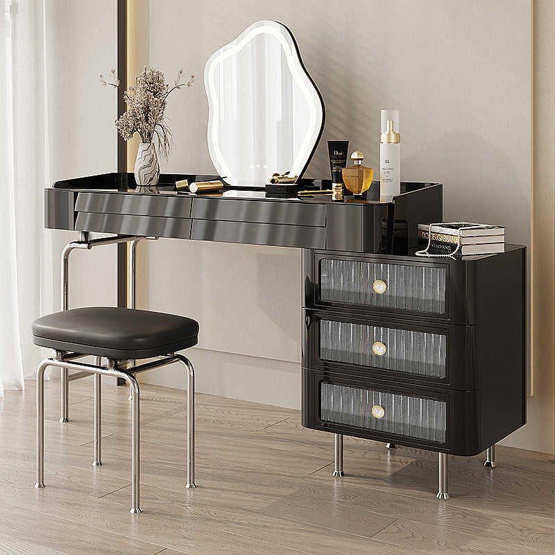 Elegant black wooden makeup vanity table set showcasing its sleek design and stainless steel legs.