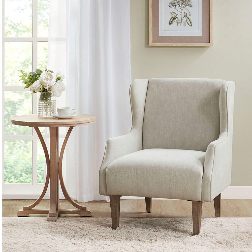 Side view of the Malcolm Vintage Accent Chair showcasing its elegant design and comfortable fabric.