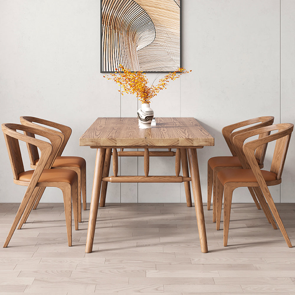Elegant 63" wooden dining table showcasing its patchwork tabletop from the side.
