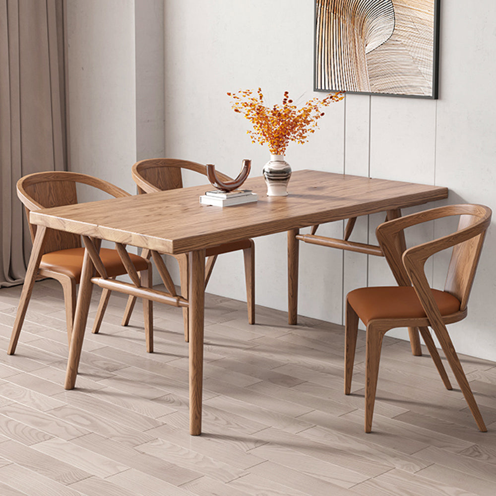 Top view of the modern dining table highlighting the natural wood grain and sleek legs.