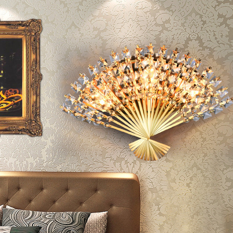 Close-up of the elegant crystal fan-shape wall sconce showcasing its intricate design.