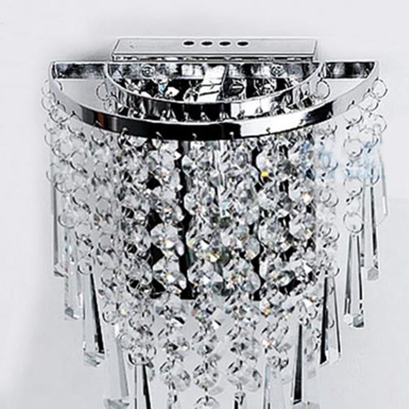 Close-up of the crystal wall lamps polished edges and high-quality materials.