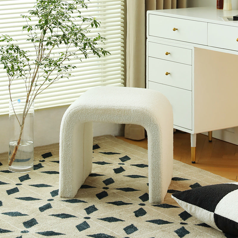 Close-up of boucle ottoman texture on waterfall bench in white finish
