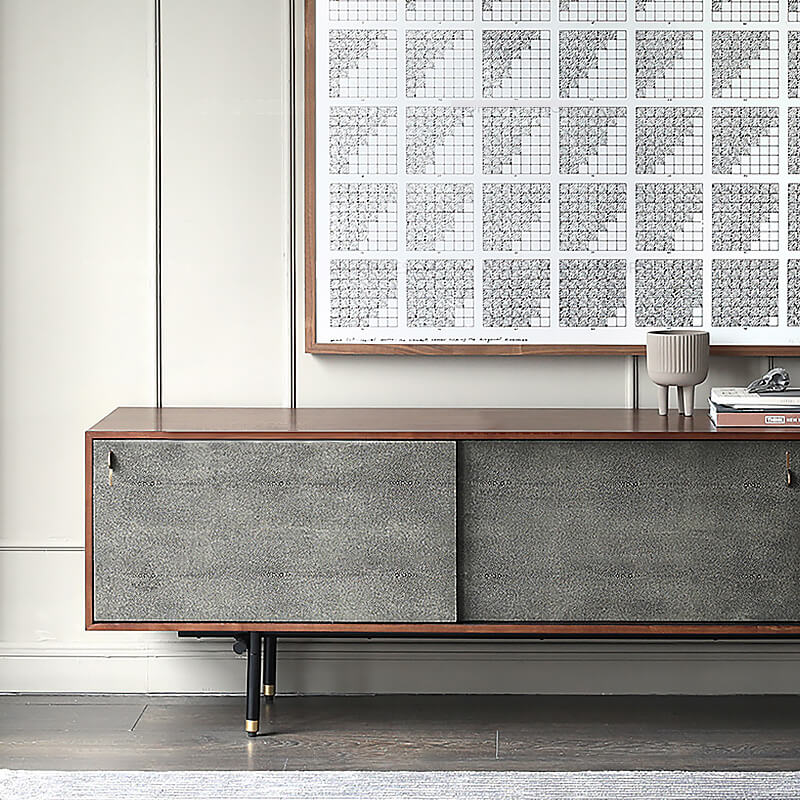 Close-up of the iron legs with gold strips on the retro TV stand, emphasizing craftsmanship.