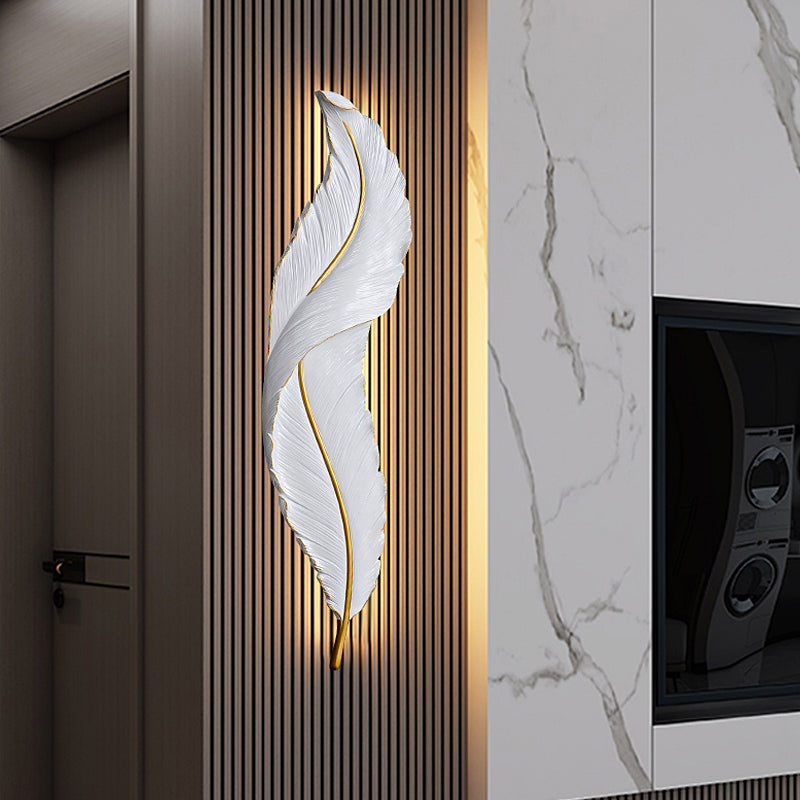 Elegant feather LED wall sconce in a stylish living room setting.