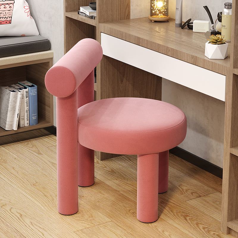 Stylish modern ottoman chair in white velvet placed in a modern living room.