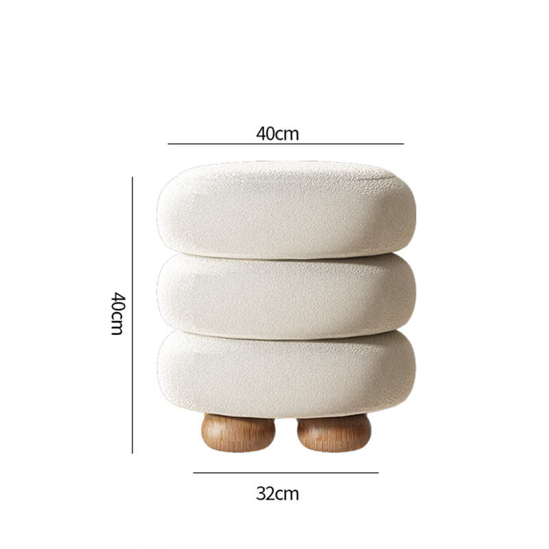 Chic white round upholstered vanity stool with natural wood legs in a modern dressing area.