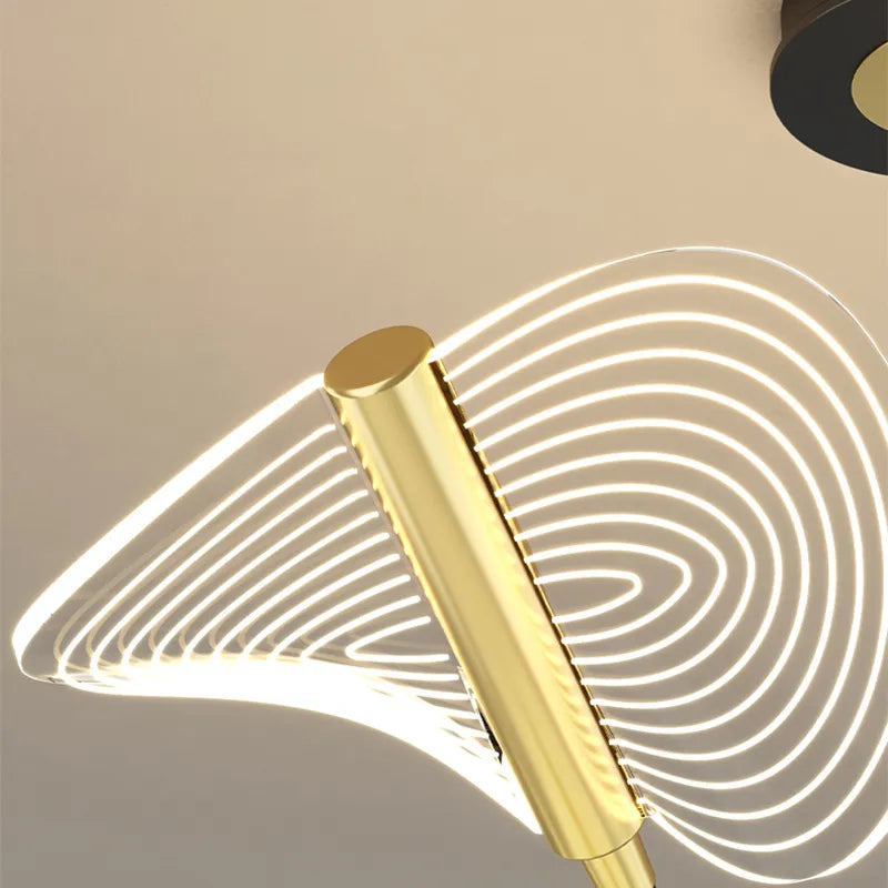 Close-up view of the contemporary gold wavy glass LED wall sconce showcasing its sleek design.