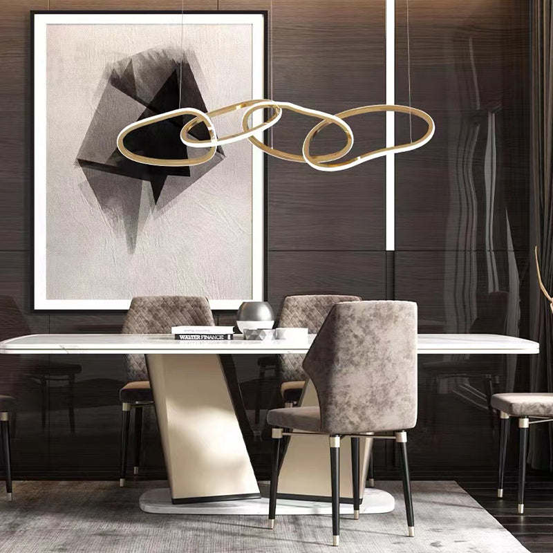Close-up of the gold pendant light showcasing its crystal highlights.