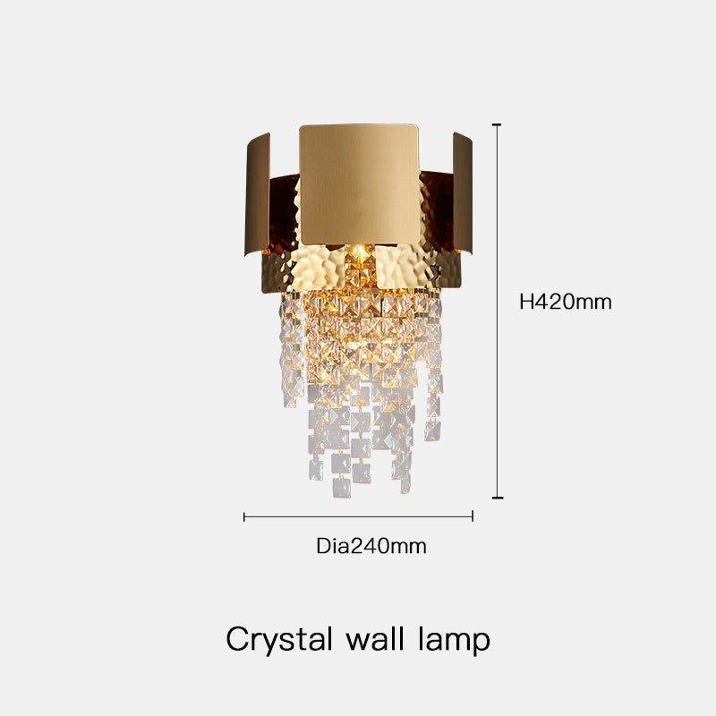 Close-up of the elegant gold crystal raindrop wall sconce showcasing its unique design.